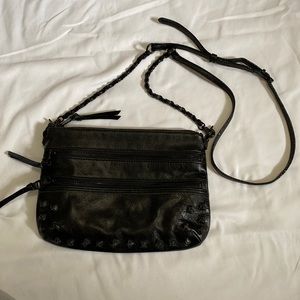 Elliott Luca small black leather crossbody with adjustable strap.